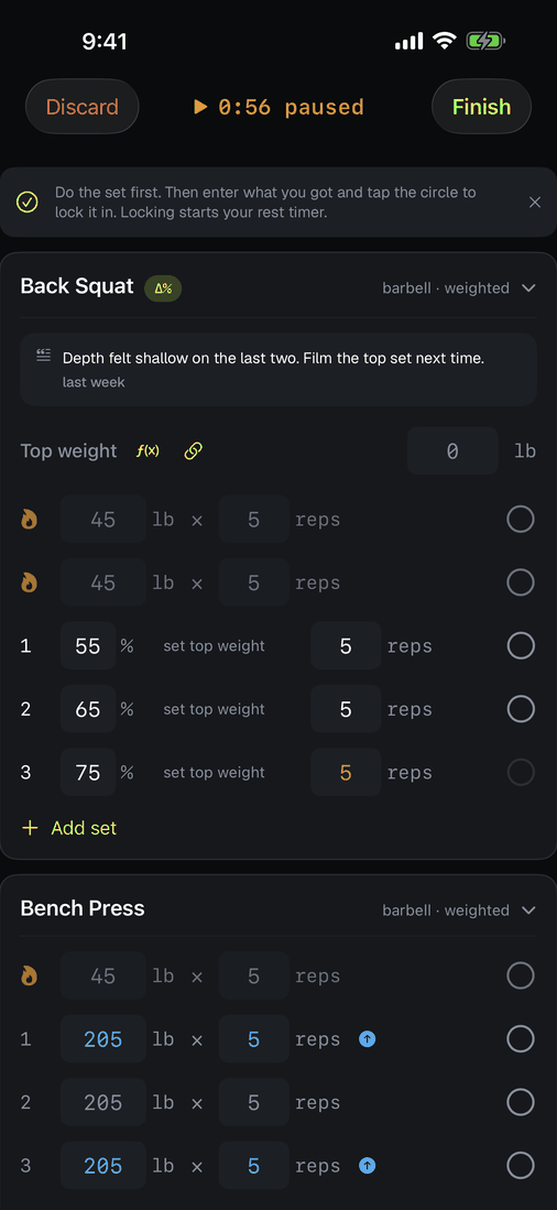 The workout clock shown paused in amber.
