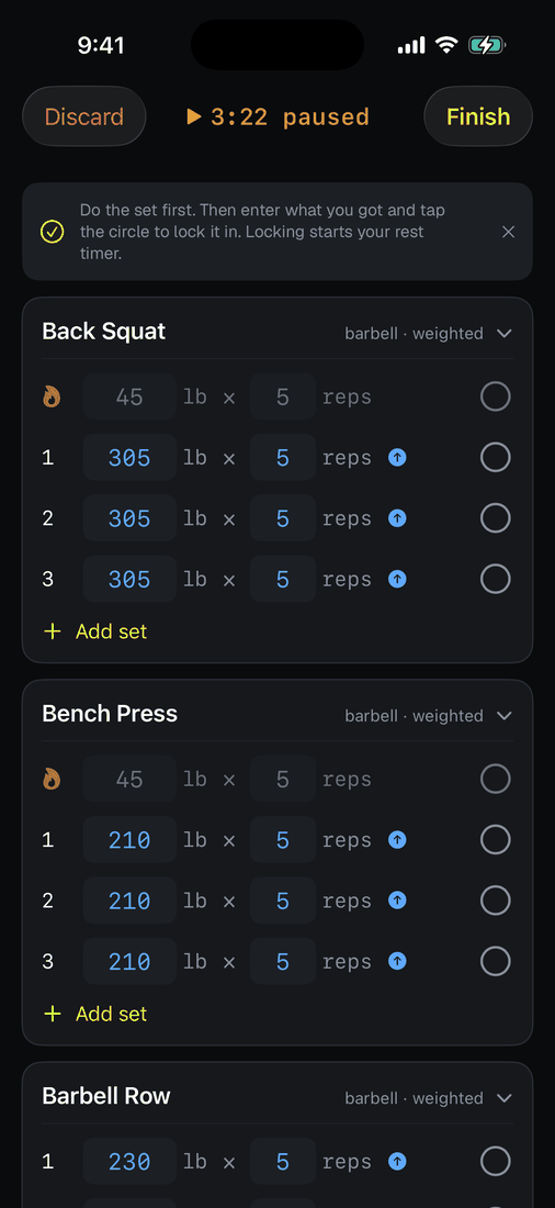 The workout clock shown paused in amber.