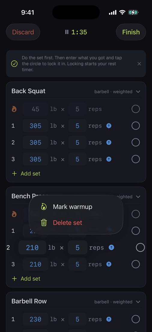 The long-press menu on a set row showing Mark warmup and Delete set.